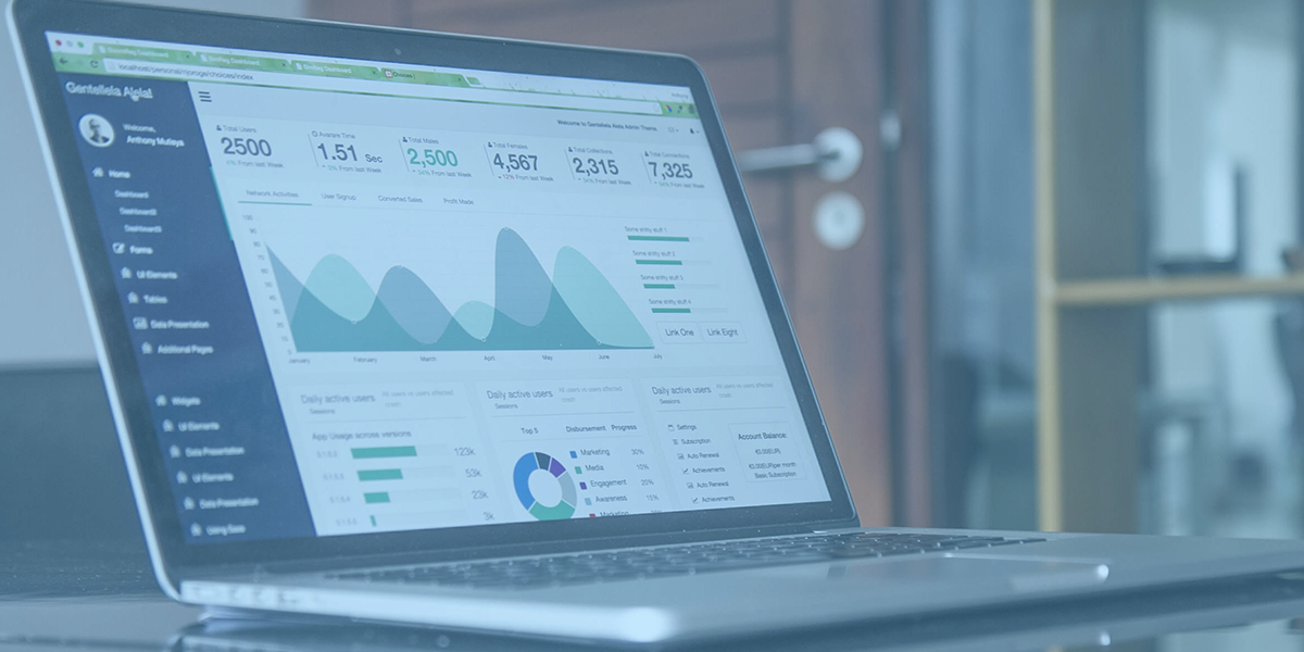 laptop open with analytics dashboard showing data